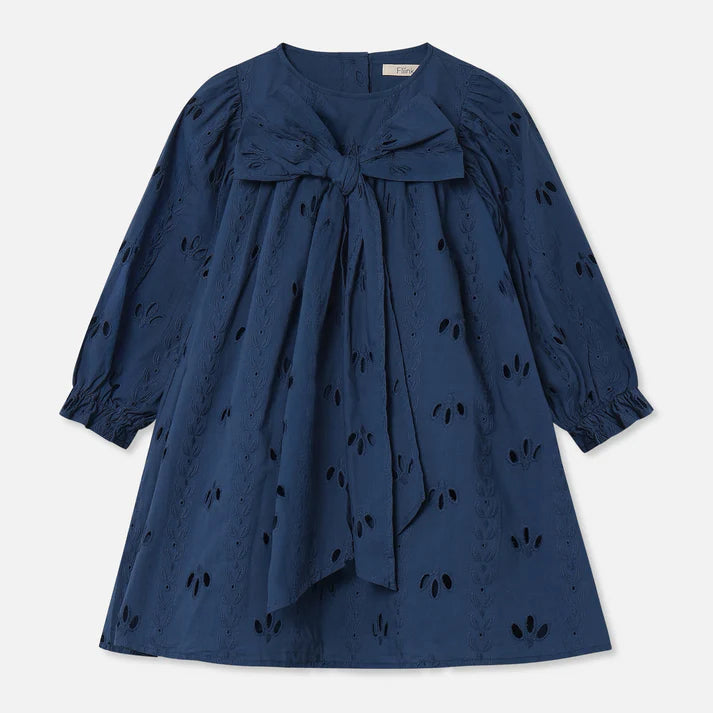 Navy blue dress with a bow detail on a light gray background