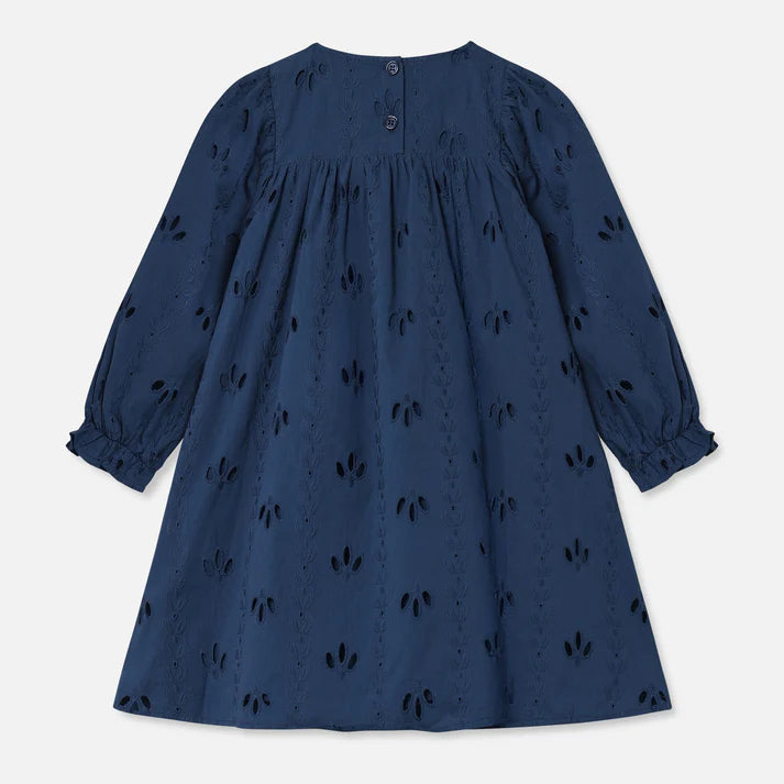 Navy blue dress with black floral pattern on a light gray background