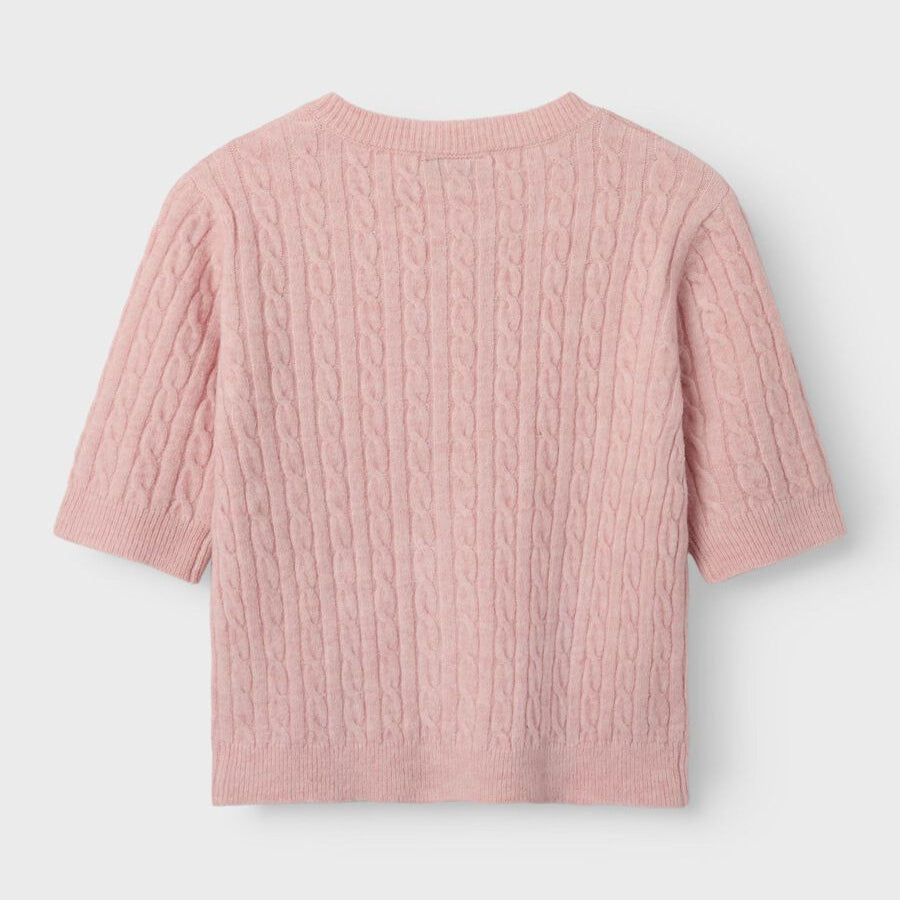 Pink textured cardigan on a light gray background