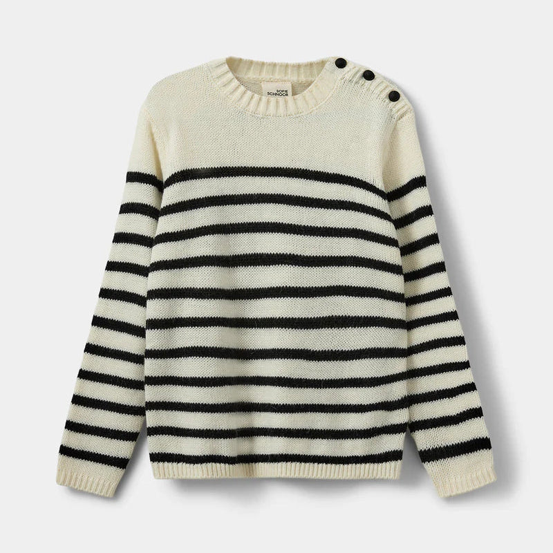 White sweater with black stripes on a light gray background