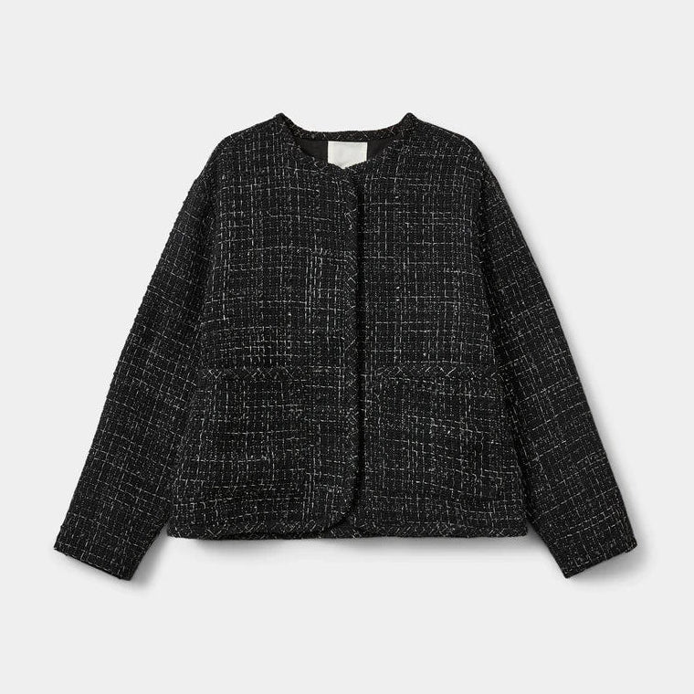 Black and silver checkered jacket on a light gray background