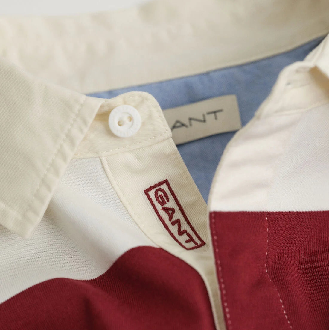 Close-up of a GANT branded shirt with a collar and label.