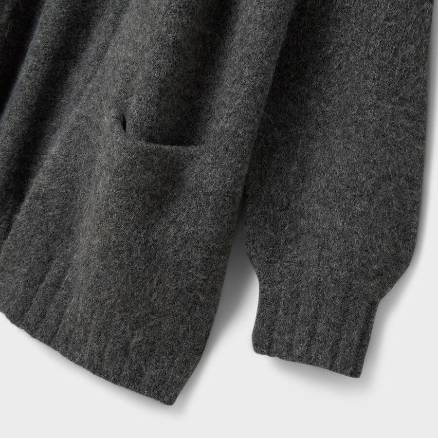 Close-up of a gray sweater on a white background