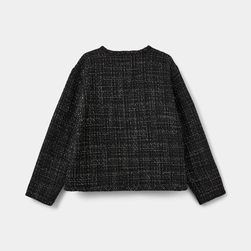 Black checkered shirt on a light gray background