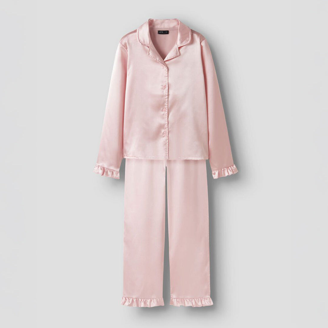 Pink satin pajama set on a light gray background